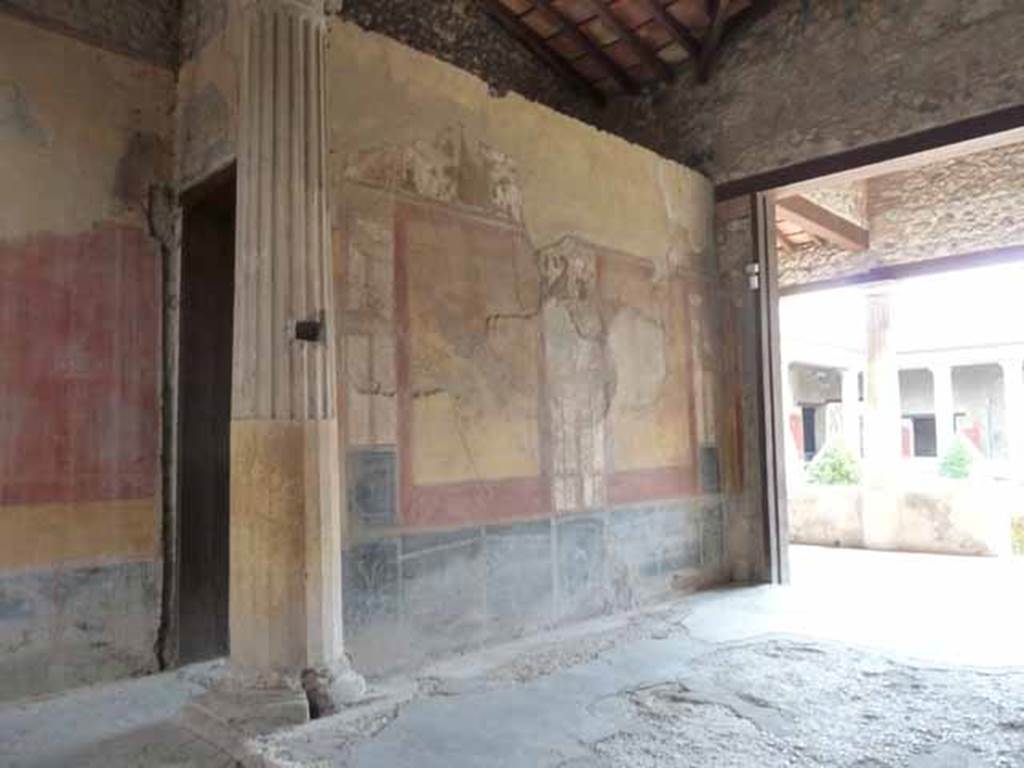 I.10.4 Pompeii. May 2010. Room 8, east wall of the tablinum. The entrance to corridor 9 can be seen on the left.