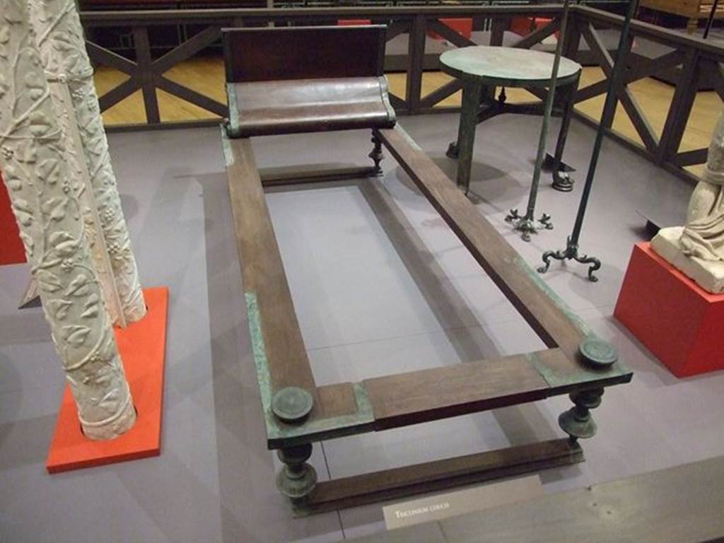 I.10.4 Pompeii. Reconstructed wood and bronze triclinium bed. SAP 4270a. 
Photographed at “A Day in Pompeii” exhibition at Melbourne Museum. September 2009. The original was found in Room 8, the tablinum, on 18th August 1928.