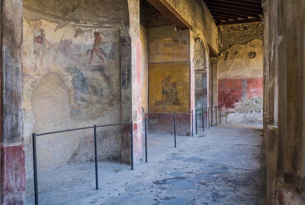 I.10.4 Pompeii. April 2022. 
Looking west towards alcoves 22, 23, 24 and 25 on south side of portico. Photo courtesy of Johannes Eber.