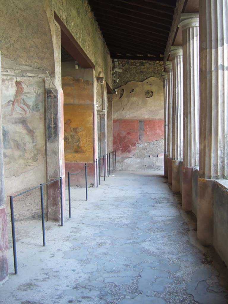 I.10.4 Pompeii. December 2006. 
Looking west along south side of peristyle with alcoves 22, 23, 24 and 25.