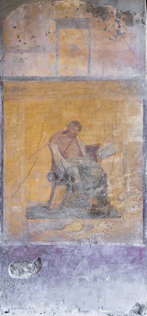 I.10.4 Pompeii. April 2022. 
Alcove 23, centre of west wall with painting of poet.
Photo courtesy of Johannes Eber.