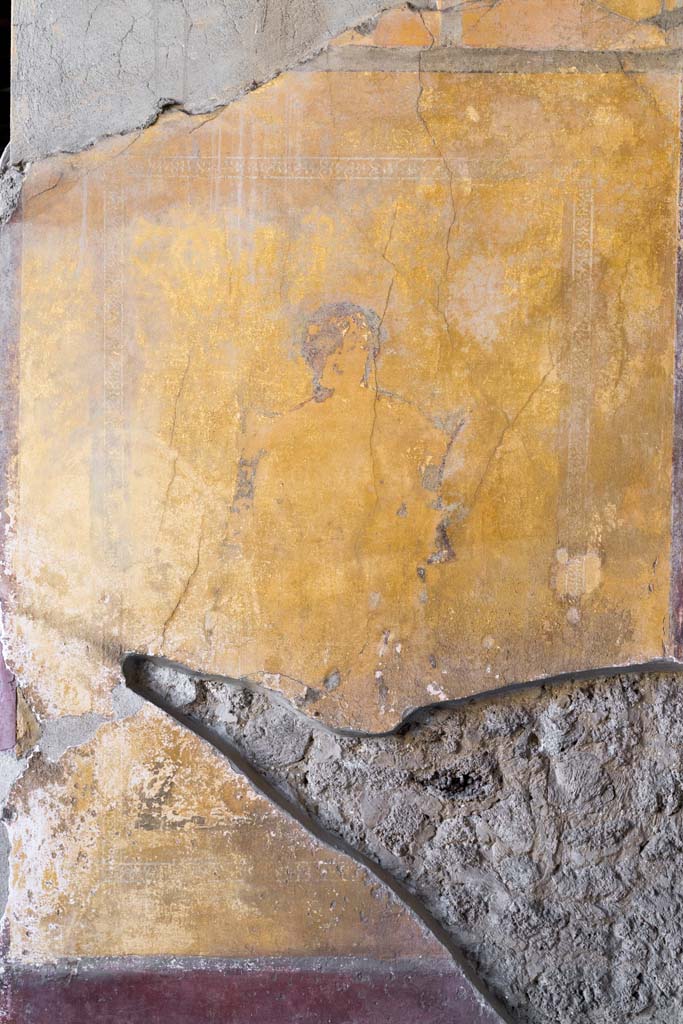 I.10.4 Pompeii. April 2022. Alcove 23, east wall. Photo courtesy of Johannes Eber.
According to PPM –
In the middle zone of the east wall would have been a painted panel with a sitting poet (perhaps Euripides?), with a painted “carpet border” around the edge of the panel.
See Carratelli, G. P., 1990-2003. Pompei: Pitture e Mosaici: Vol. II. Roma: Istituto della enciclopedia italiana, (p.366 and 367, no. 202).