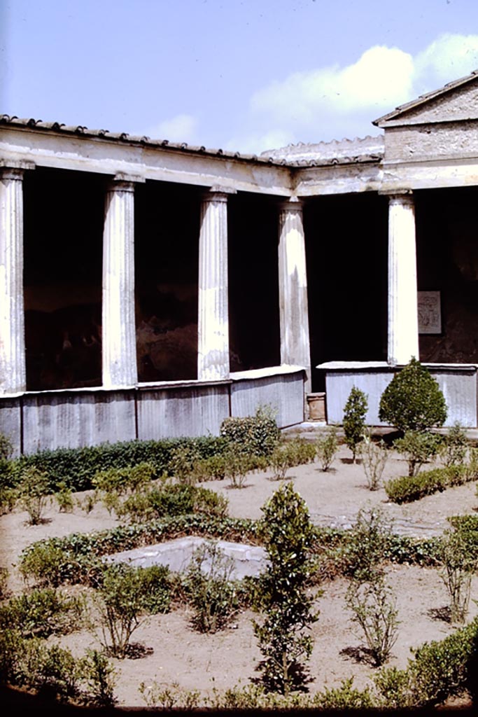 I.10.4 Pompeii. 1968.  
North-west corner of peristyle garden with covering over pluteus to try and protect the paintings.  
Photo by Stanley A. Jashemski.
Source: The Wilhelmina and Stanley A. Jashemski archive in the University of Maryland Library, Special Collections (See collection page) and made available under the Creative Commons Attribution-Non-Commercial License v.4. See Licence and use details.
J68f0053