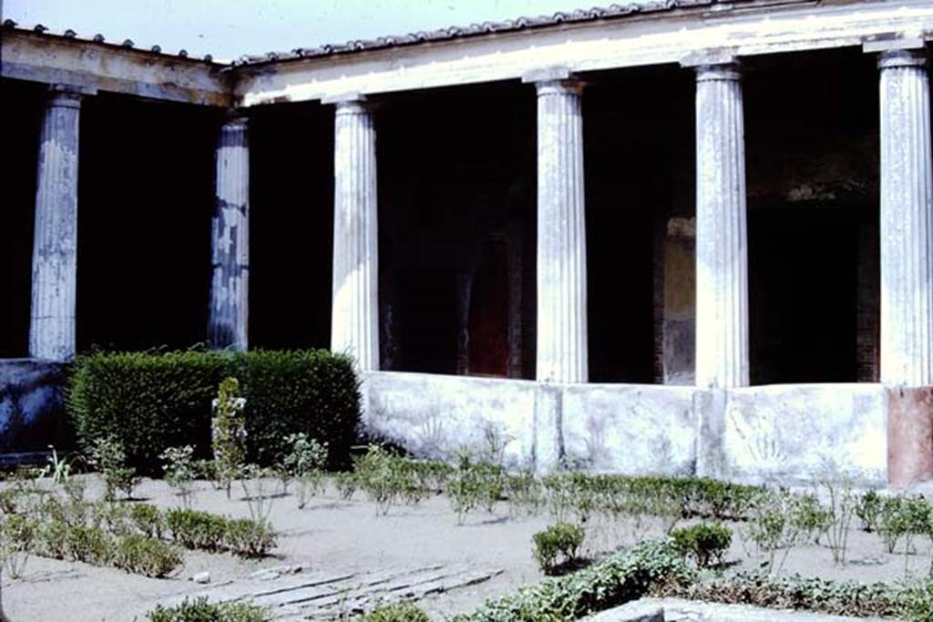 I.10.4  Pompeii. 1966. North-east corner of peristyle garden with painted east pluteus wall.  Photo by Stanley A. Jashemski.
Source: The Wilhelmina and Stanley A. Jashemski archive in the University of Maryland Library, Special Collections (See collection page) and made available under the Creative Commons Attribution-Non Commercial License v.4. See Licence and use details.
J66f0389