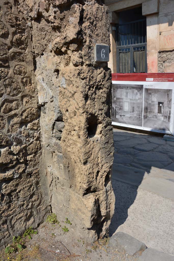 I.10.6 Pompeii. April 2017. 
West side of entrance doorway in north-west corner of workshop, with identification number-plate.
Photo courtesy Adrian Hielscher.