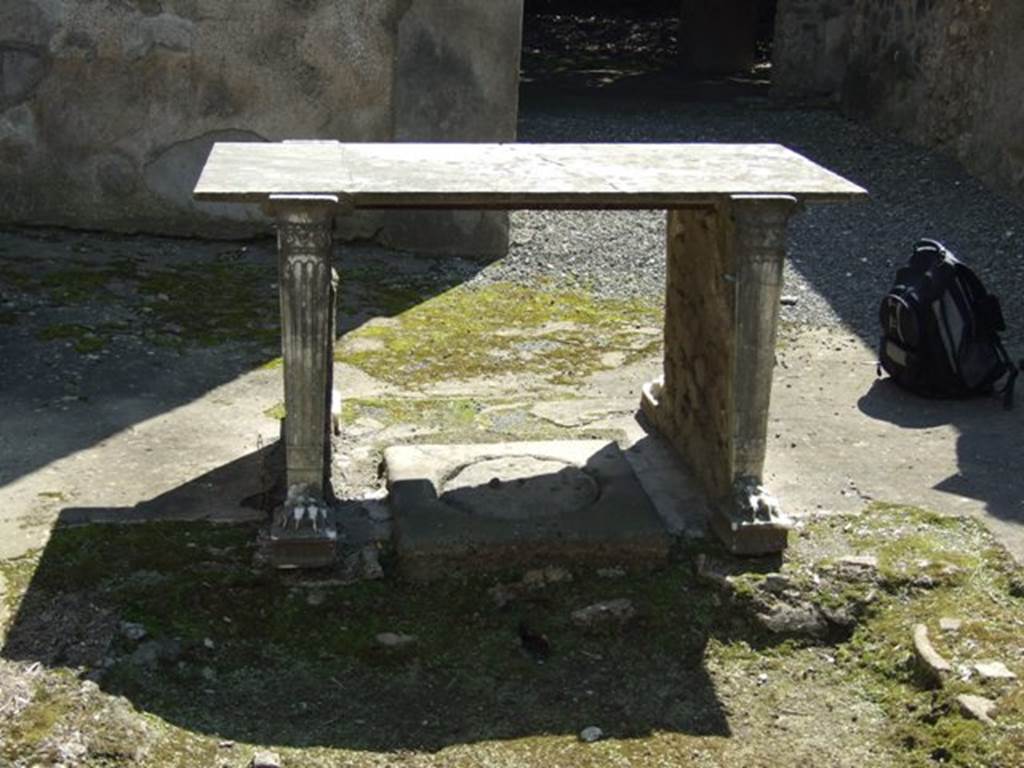 I.10.7 Pompeii. March 2009. Room 4, marble table in atrium. Looking south.