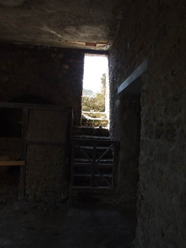 I.10.7 Pompeii. March 2009. Room 11, kitchen. Looking west towards stairs to upper floor.
According to NdS – 
this brick stairs led up by 7 steps to another set of 7 steps which led to a terrace, and perhaps to the upper rooms.
See Notizie degli Scavi, 1934, (p.280.)