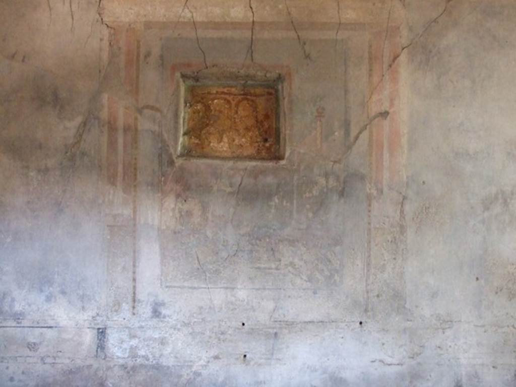 I.10.7 Pompeii. March 2009. Room 12, east wall of triclinium. Remains of wall painting of a sacred landscape, cut through by the lararium niche.
According to Peters, the sacred landscape from this wall was decayed beyond recognition (p.90).