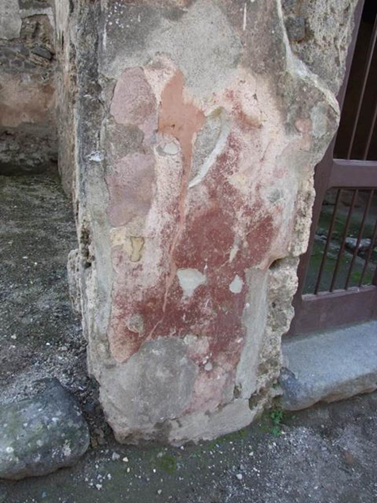 I.10.7 Pompeii.  December 2007.  Painted plaster to the left of the entrance.