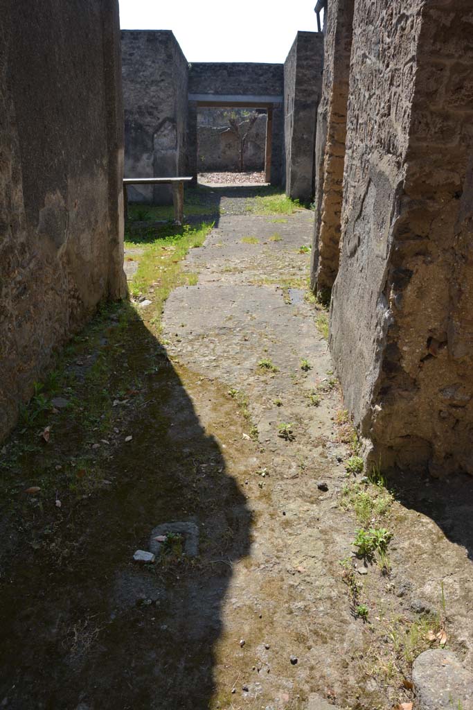 I.10.7 Pompeii. April 2017. Looking south along entrance corridor, with doorstop in flooring.
Photo courtesy Adrian Hielscher.
