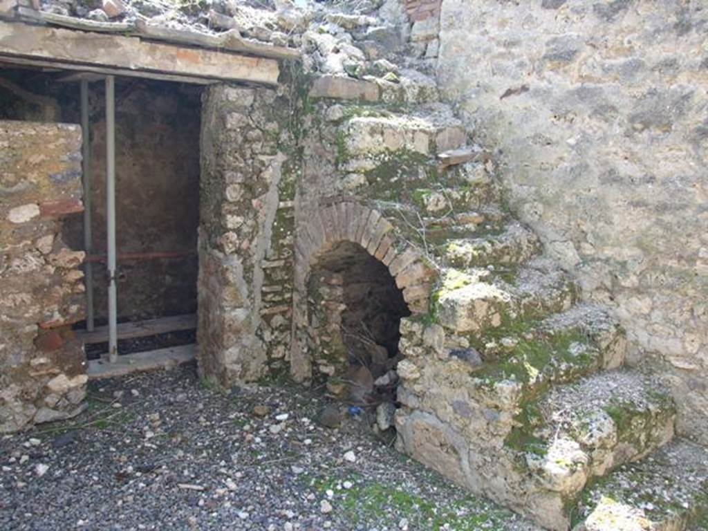 I.10.8 Pompeii. March 2009. Room 5, south-west corner of the yard, with stairs to upper gallery and cupboard under, and doorway to small room.