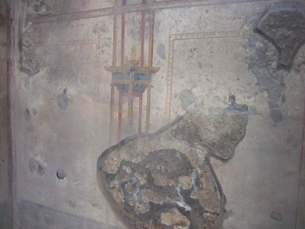 I.10.11 Pompeii. March 2009. Room 7, south wall of cubiculum with a painting of a sphinx in both side panels. 
Also, in the north wall, on both west and east sides of the doorway, a painted sphinx is also seen.   
On the west wall, not photographed, there were also small painted panels; at the south end were painted ducks among rushes, and at the north end was another painted crocodile. 
According to PPM –
In room 7, there was a simple decoration painted on a white background with other architectural views and small panels of sphinxes and crocodiles or ducks among rushes. 
See Carratelli, G. P., 1990-2003. Pompei: Pitture e Mosaici. II. (2). Roma: Istituto della enciclopedia italiana, (p.469).