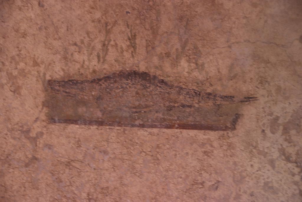I.10.11 Pompeii. October 2022. 
Room 7, painting of a crocodile from the north end of the west wall of cubiculum. Photo courtesy of Klaus Heese.