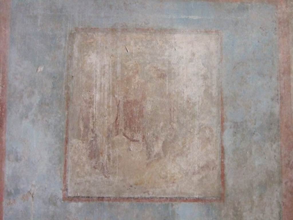 I.10.11 Pompeii. March 2009. Room 8, remains of central wall painting of Ariadne and Dionysus, from south wall of triclinium.  
See Bragantini, de Vos, Badoni, 1981. Pitture e Pavimenti di Pompei, Parte 1. Rome: ICCD.  (p.143).
Kuivalainen describes –
“A composition of at least five figures. In the right corner foreground is a reclining female with her face towards the viewer; her yellow cloak covers her legs and is lifted by a cupid, who stands behind her. In the middle, a standing youth watches the sleeping female. Next to him stand two others, one wearing a red cloak down to the hips.”
Kuivalainen comments –
“The foremost figure in the middle is Bacchus, and the one in the red cloak is Silenus. The pictorial programme of the room may concentrate on abandoned lovers, even if a better destiny awaits Ariadne.”
See Kuivalainen, I., 2021. The Portrayal of Pompeian Bacchus. Commentationes Humanarum Litterarum 140. Helsinki: Finnish Society of Sciences and Letters, (p.147, E8).