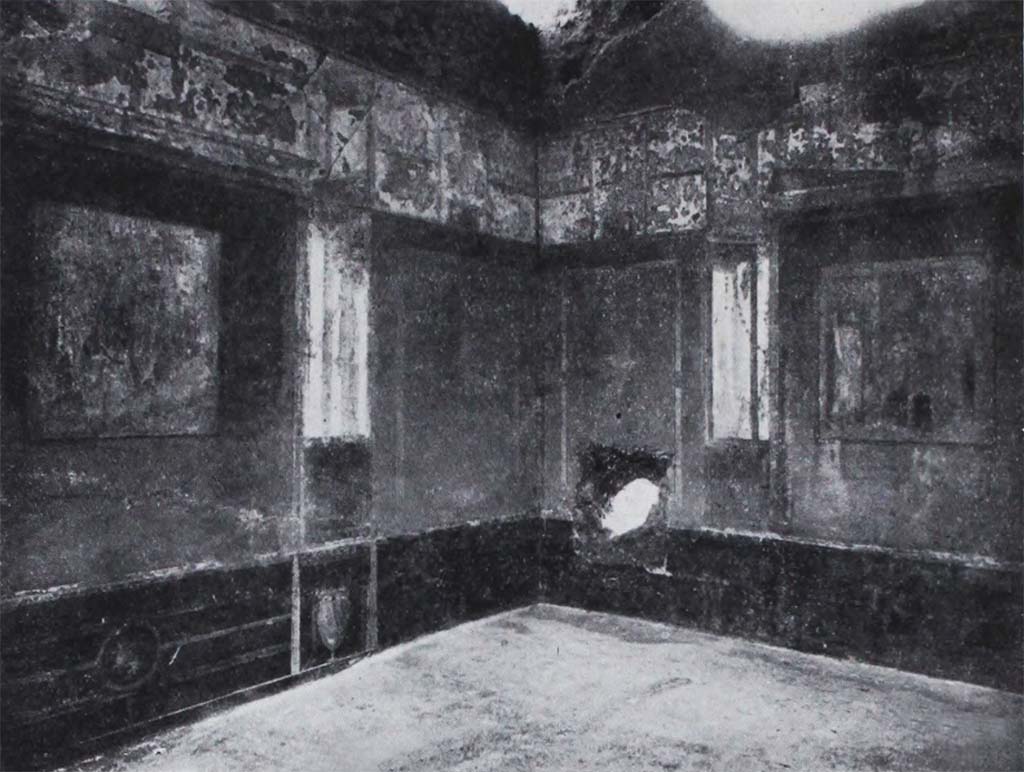 I.10.11 Pompeii. Room 8, looking towards painted decoration in south-west corner, and ancient hole in west wall of triclinium.  
See Notizie degli Scavi di Antichità, 1934, (p.330, fig.34).