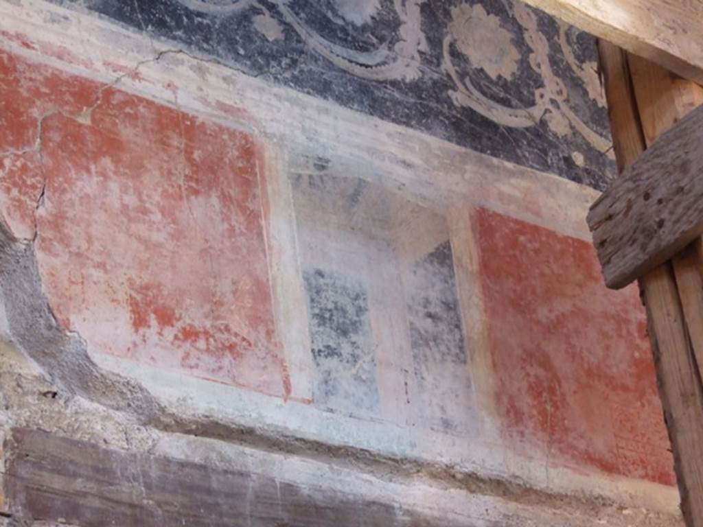 I.10.11 Pompeii. March 2009. Room 2, painted decoration in north-west corner of atrium above doorway to room 9.