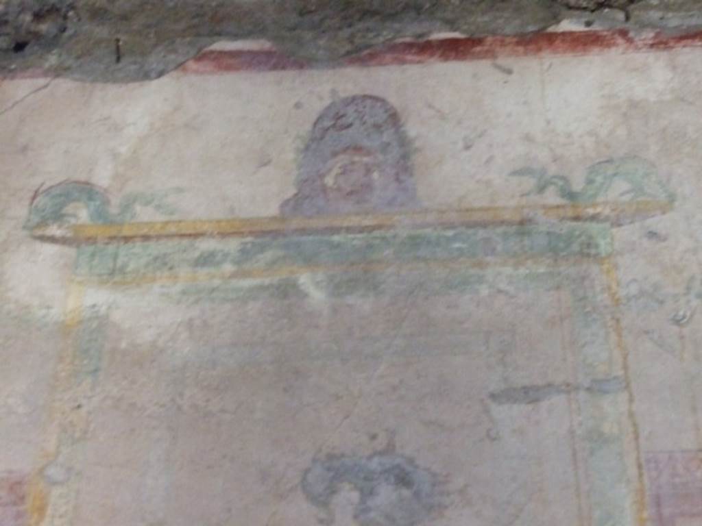 I.10.11 Pompeii. March 2009. Room 9, painting of mask and dolphins from west wall of cubiculum.  See Bragantini, de Vos, Badoni, 1981. Pitture e Pavimenti di Pompei, Parte 1. Rome: ICCD.  (p.141).