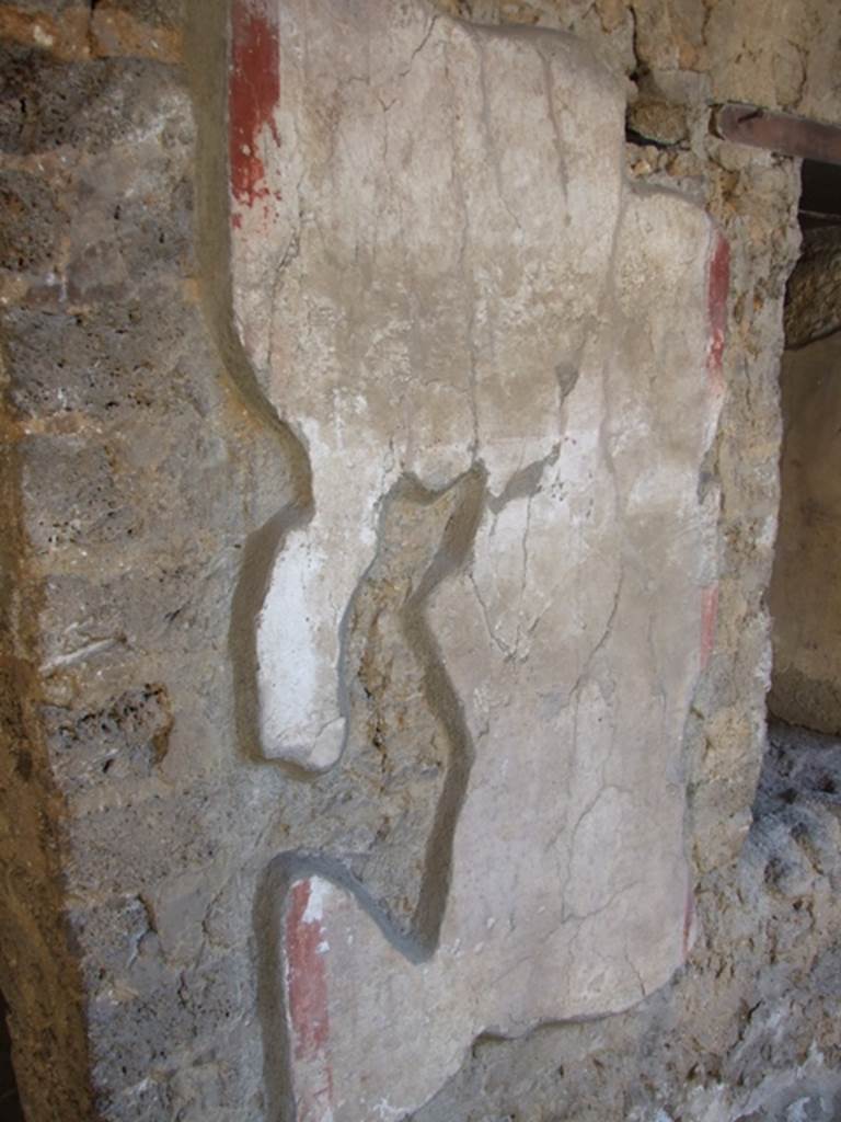 I.10.11 Pompeii. March 2009. Room 10, east wall of peristyle, between doorway and window of room 11.  Site of graffiti?