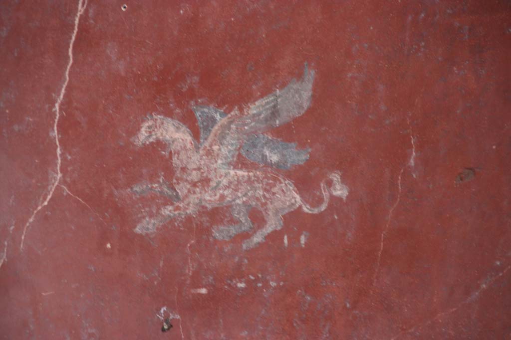 I.10.11 Pompeii. September 2021. 
Room 12, painting of Pegasus from centre of panel at south end of east wall of cubiculum. Photo courtesy of Klaus Heese.