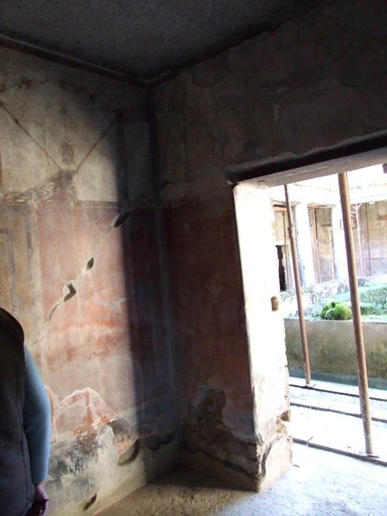 I.10.11 Pompeii. March 2009. Room 12, south-west corner of cubiculum, with doorway in west wall to peristyle.