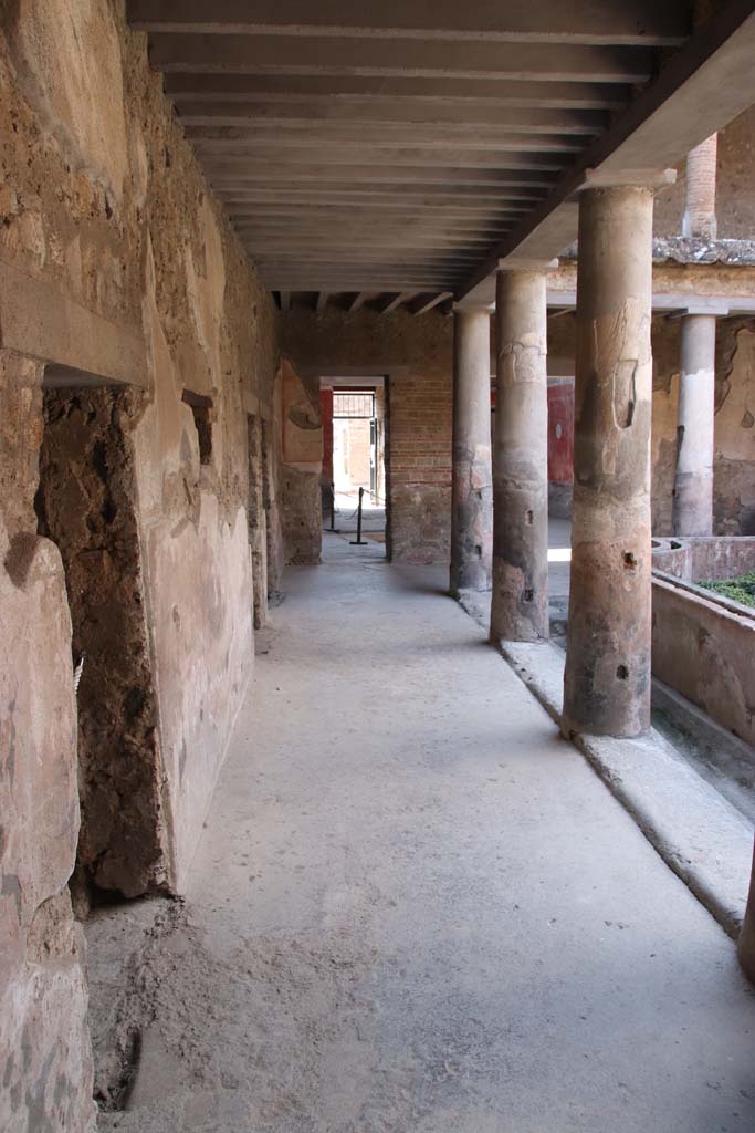 I.10.11 Pompeii. September 2021. 
Room 10, looking west along south side of peristyle from outside doorway to room 17.  
Photo courtesy of Klaus Heese.
