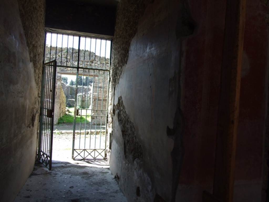 I.10.11 Pompeii. March 2009. Room 1, north wall of fauces or entrance corridor, looking west to entrance doorway.