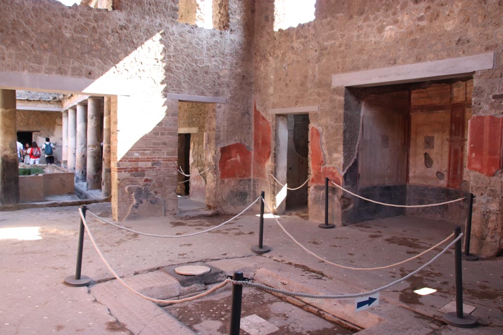 I.10.11 Pompeii. October 2022. Room 2, looking south-east across impluvium in atrium. Photo courtesy of Klaus Heese.