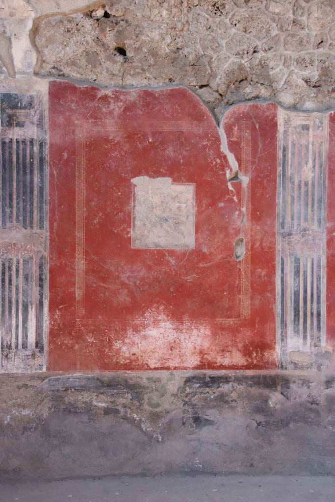 I.10.11 Pompeii. September 2021. 
Room 2, wall painting in central panel on north wall of atrium. Photo courtesy of Klaus Heese.