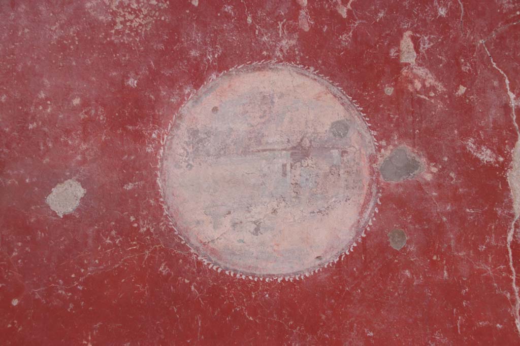 I.10.11 Pompeii. September 2021. 
Room 2, detail of Sacred Landscape on medallion on east (right) end of north wall. Photo courtesy of Klaus Heese.