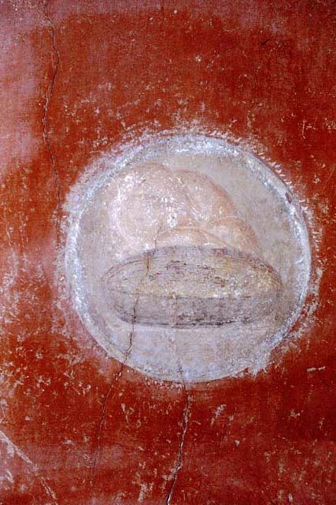 I.10.11 Pompeii, 1968. Room 2, painted medallion of bread and plate, from north-west corner of atrium. 
Photo by Stanley A. Jashemski.
Source: The Wilhelmina and Stanley A. Jashemski archive in the University of Maryland Library, Special Collections (See collection page) and made available under the Creative Commons Attribution-Non Commercial License v.4. See Licence and use details.
J68f0491
