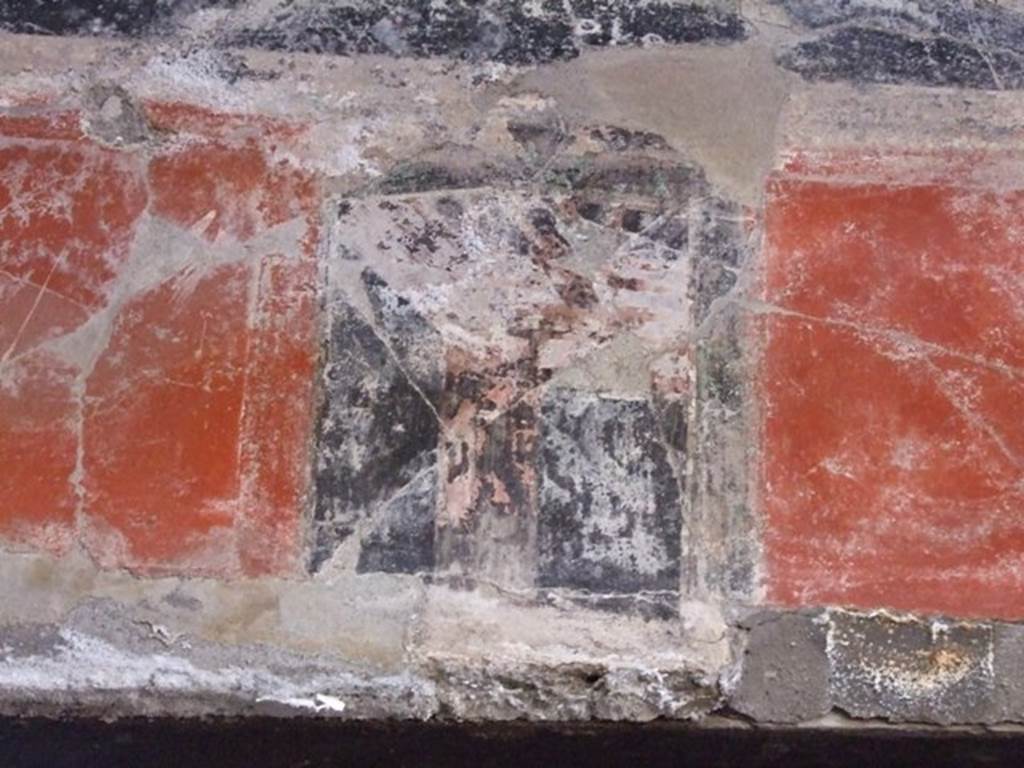 I.10.11 Pompeii. March 2009. Room 2, painted decoration on west wall in south-west corner of atrium above doorway to room 3.