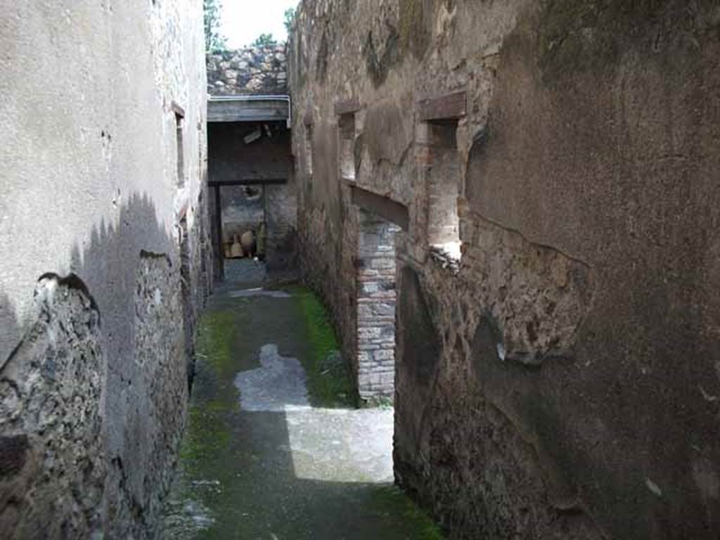 I.10.15 Pompeii. May 2010. Looking east along corridor from peristyle of I.10.4, leading to service quarters.
