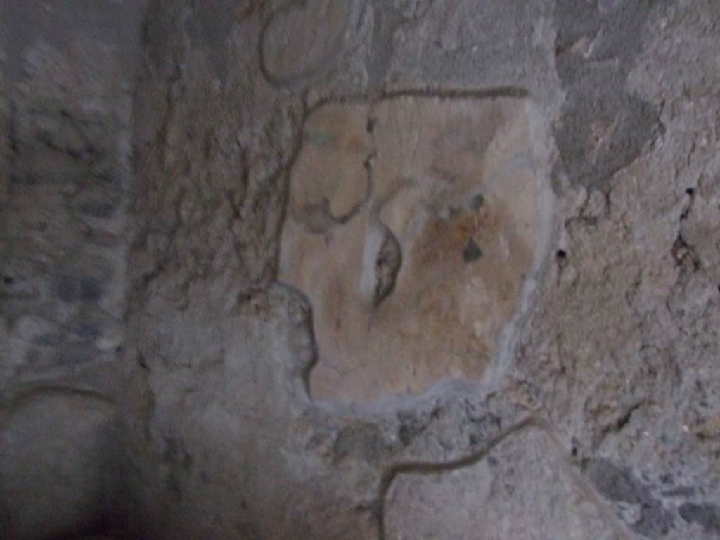 I.10.16 Pompeii. March 2009. L-shaped Kitchen, looking south along west wall at site of lararium?.  The lararium  had a painting with garlands, possibly two Lares and a Genius and Camillus group. See Fröhlich, T., 1991. Lararien und Fassadenbilder in den Vesuvstädten. Mainz: von Zabern. (p.255, L14).
See Giacobello, F., 2008. Larari Pompeiani: Iconografia e culto dei Lari in ambito domestico.  Milano: LED Edizioni.  (P.147).