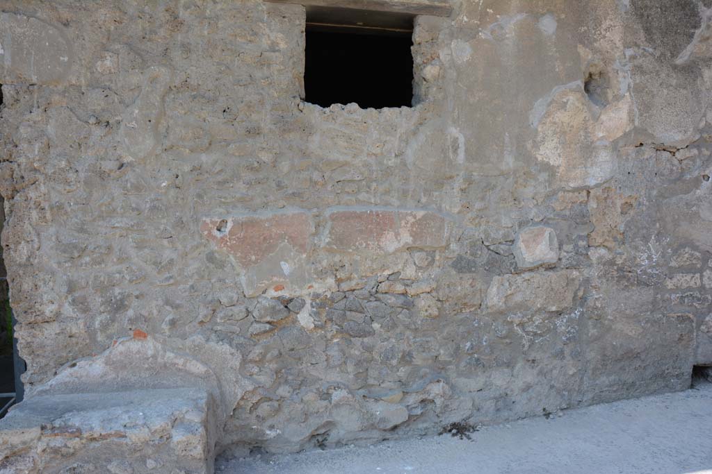 I.10.18 Pompeii. April 2017. Detail of remaining painted plaster on north side of entrance doorway. 
Photo courtesy Adrian Hielscher.