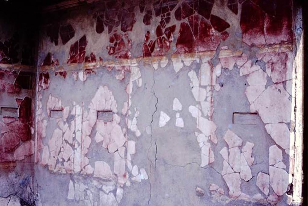 I.10.18 Pompeii. 1980 or 1983. North-east corner and east wall of room on upper floor. The small paintings have been removed.  
Source: The Wilhelmina and Stanley A. Jashemski archive in the University of Maryland Library, Special Collections (See collection page) and made available under the Creative Commons Attribution-Non Commercial License v.4. See Licence and use details. J80f0559