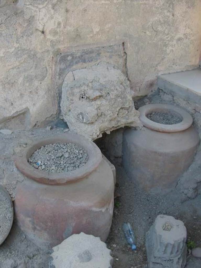 I.11.1 Pompeii. May 2003. Remains of shelving above urns near west side. Photo courtesy of Nicolas Monteix.