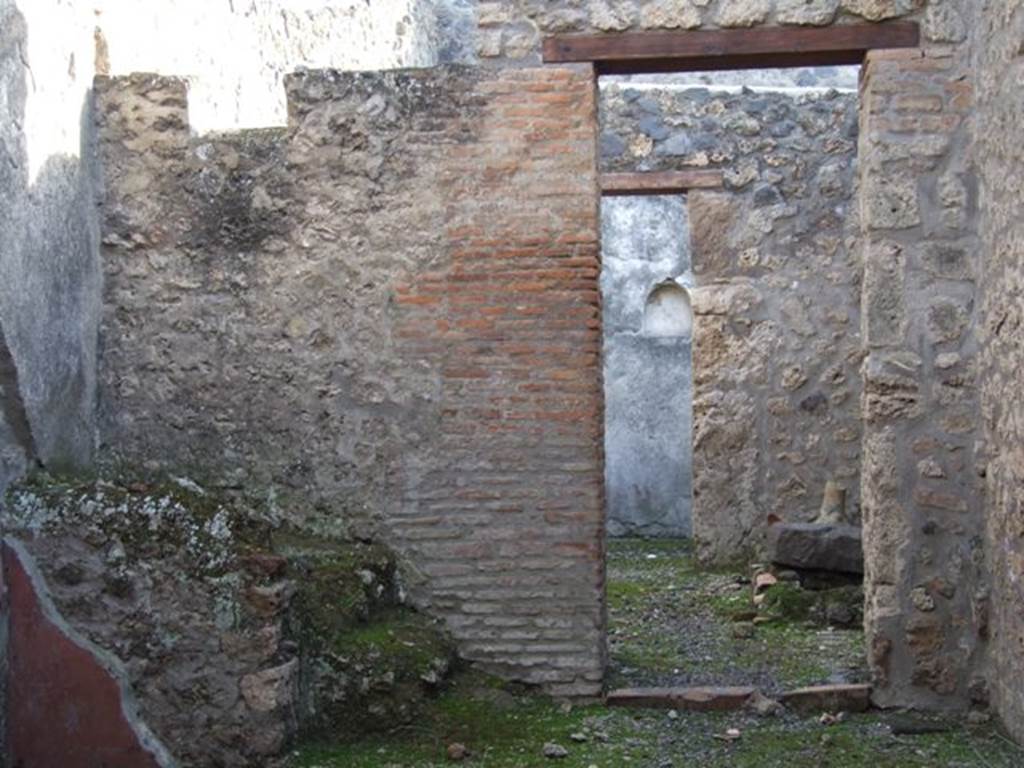 I.11.3 Pompeii. December   2007.   South wall with door to kitchen and rear door leading to garden.