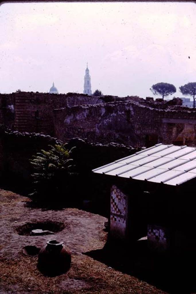 I.11.10 Pompeii. 1964. Looking south-east to small room against south wall.  Photo by Stanley A. Jashemski.
Source: The Wilhelmina and Stanley A. Jashemski archive in the University of Maryland Library, Special Collections (See collection page) and made available under the Creative Commons Attribution-Non Commercial License v.4. See Licence and use details.
J64f1904