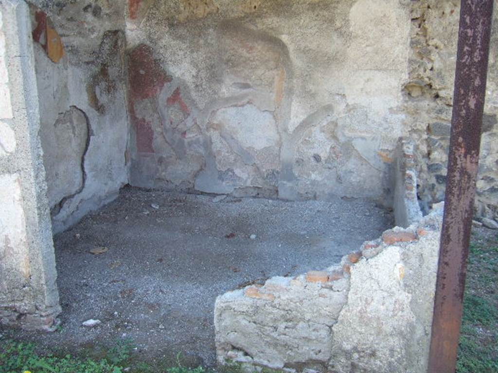 I.11.10 Pompeii. December 2006. South wall of small painted room against the south wall of the garden.
