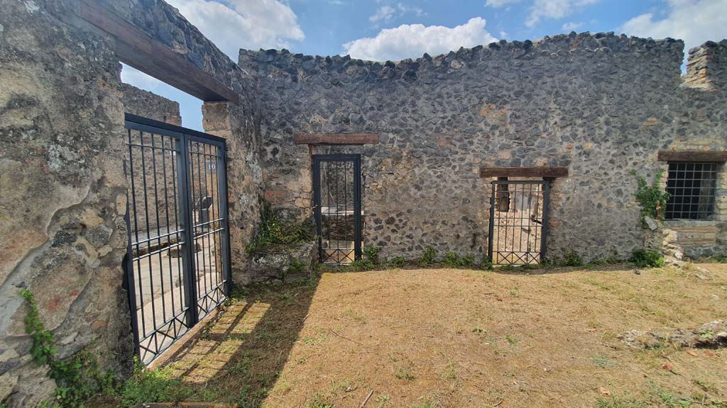I.11.10 Pompeii. July 2021. 
Looking west towards entrance doorway, on left, two doorways into bar-room, and window into room for clients. 
Foto Annette Haug, ERC Grant 681269 DÉCOR.