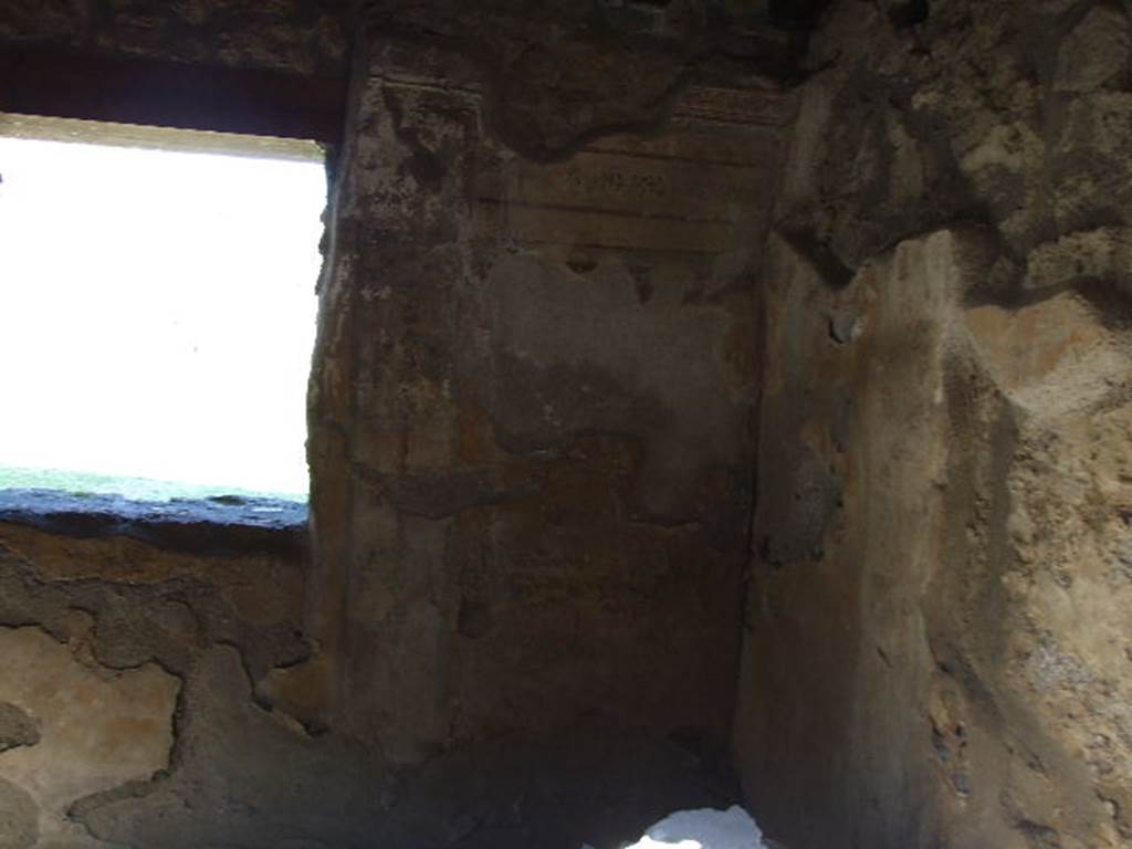 I.11.11 Pompeii. December 2006. 
Room for the clients/customers, east wall and south-east corner, of room with window overlooking garden.