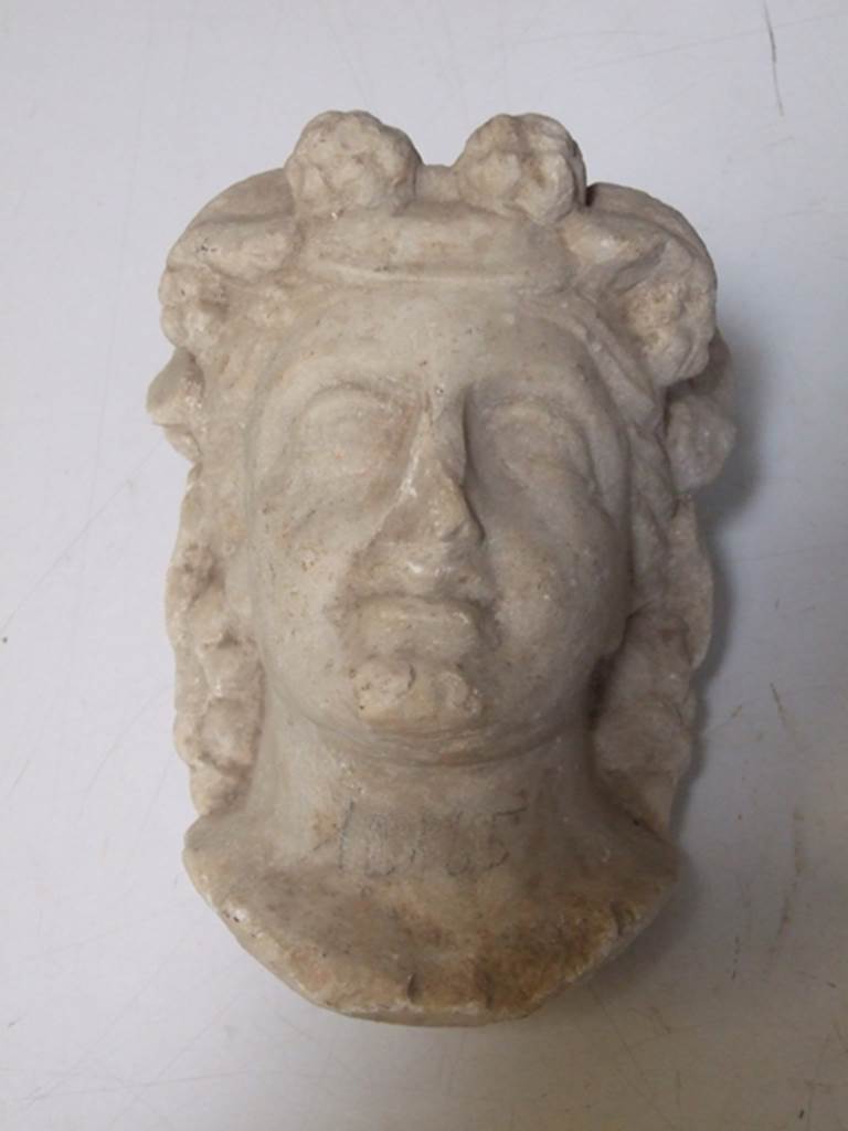 I.11.12 Pompeii. March 2009.  White marble Herm of Bacchante. Found in a cavity in the South wall near the Aedicula Niche in 1958.  SAP inventory number: 12165.