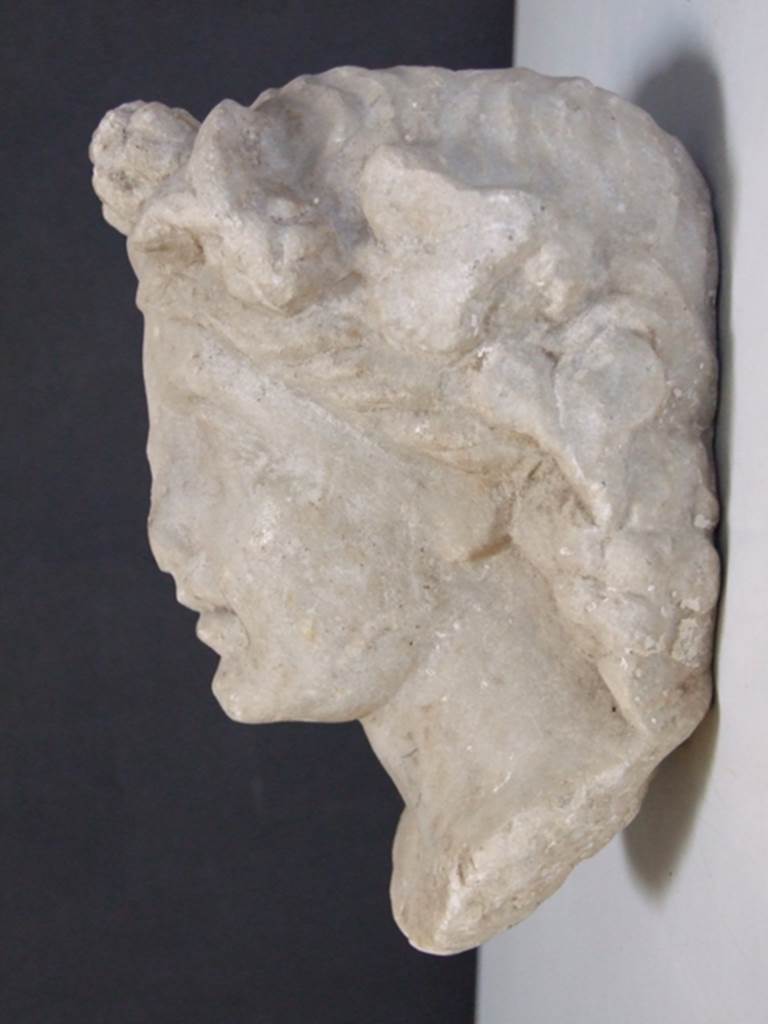 I.11.12 Pompeii. March 2009.  White marble Herm of Bacchante.  Found in a cavity in the South wall near the Aedicula Niche in 1958.  SAP inventory number: 12165.