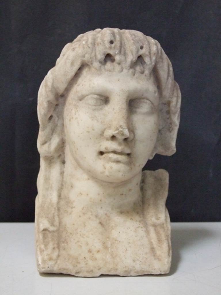 I.11.12 Pompeii. March 2009.  White marble Female Herm.  Found in a cavity in the South wall near the Aedicula Niche in 1958.  SAP inventory number: 12166.