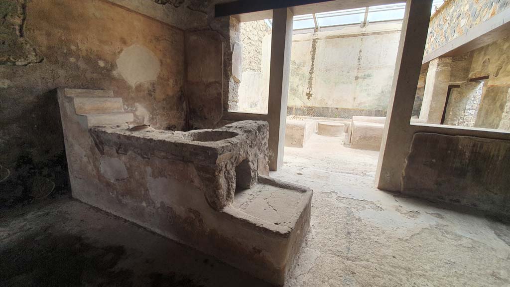 I.11.16 Pompeii. July 2021. Room 3, looking east from bar-counter with hearth towards room 6, triclinium. 
Foto Annette Haug, ERC Grant 681269 DÉCOR.