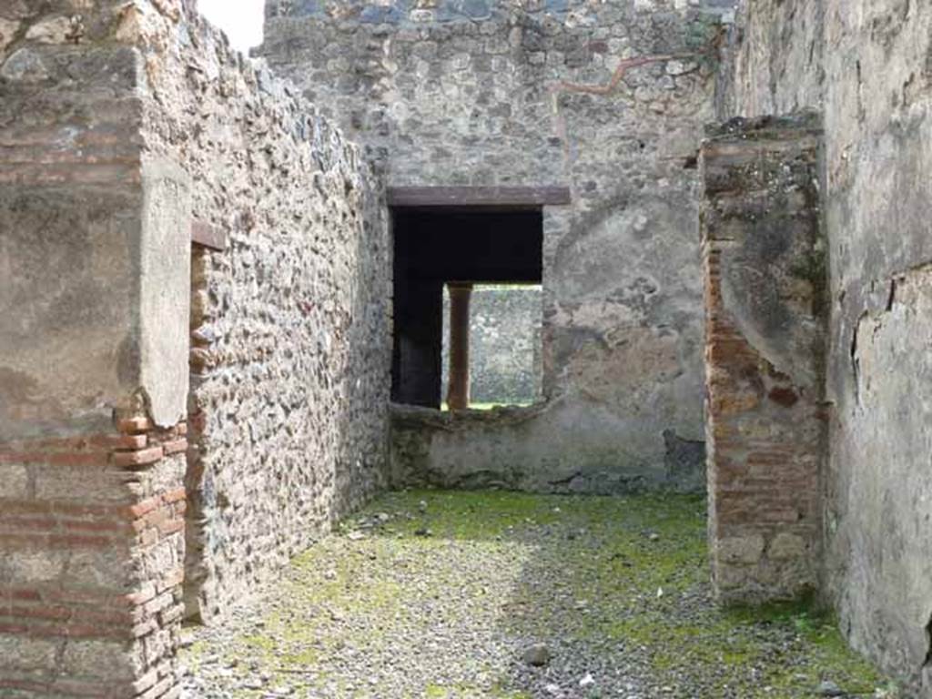 I.12.1 and I.12.2 Pompeii. May 2010. Room 2, with doorway in east wall to room 4, and window in south wall to room 7. Looking south.