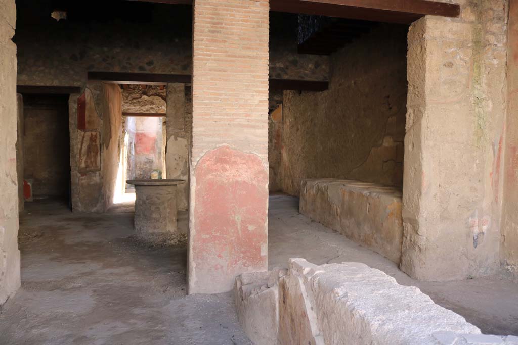 I.12.3 Pompeii. December 2018. 
Room 1, looking south across counter towards painted pilaster, and rear rooms. Photo courtesy of Aude Durand.