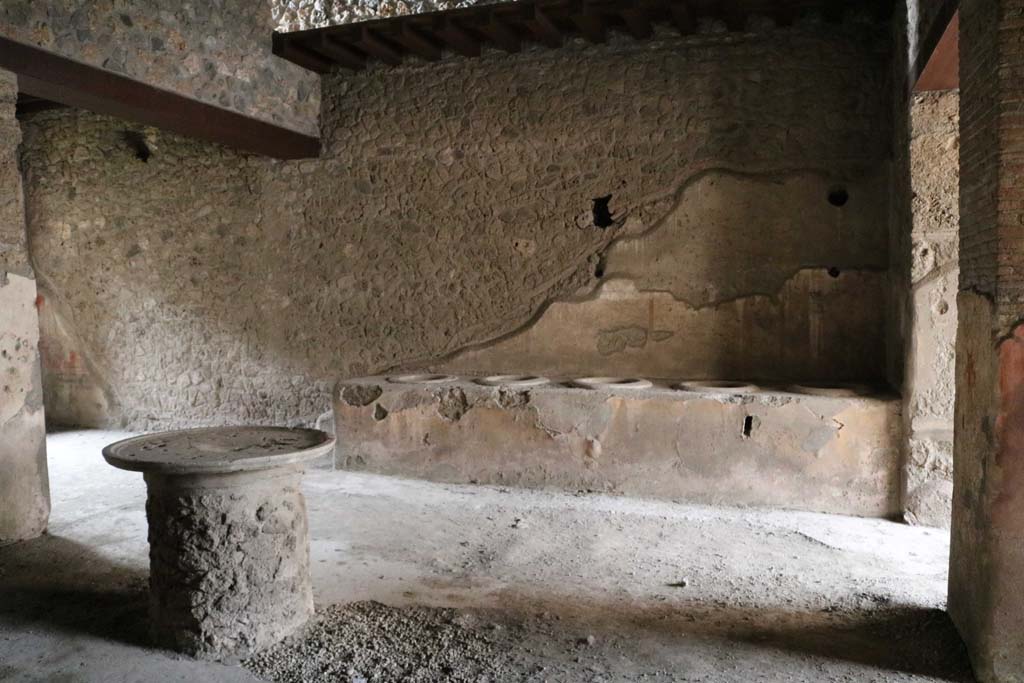 I.12.3 Pompeii, December 2018. 
Looking west across room 1, towards counter leaning against west wall of courtyard. Photo courtesy of Aude Durand.