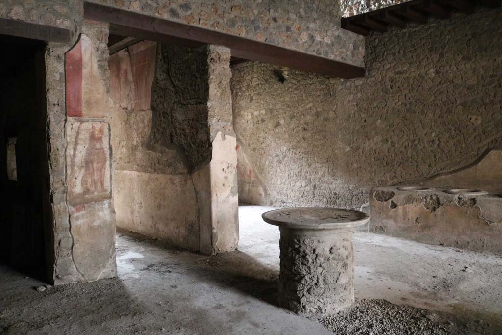I.12.3 Pompeii. December 2018. 
Room 1, looking south-west in courtyard, towards corridor and rear room. Photo courtesy of Aude Durand.