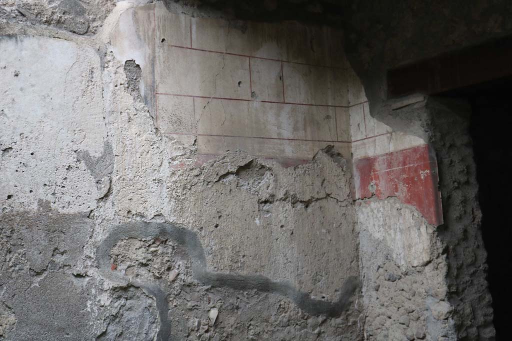 I.12.3 Pompeii. December 2018. 
Looking towards west wall in north-west corner of garden, with remaining painted decoration. Photo courtesy of Aude Durand.